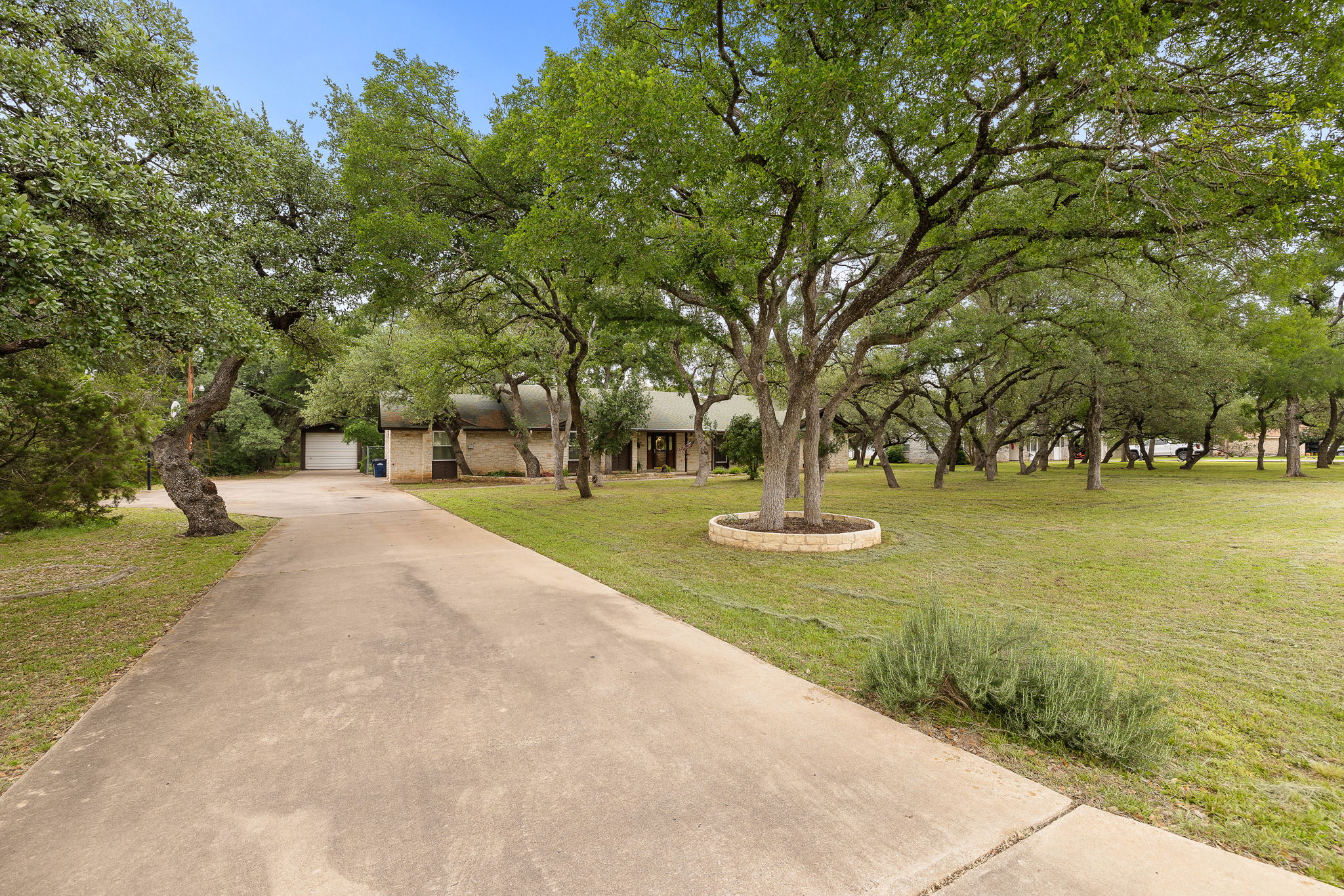 136 Valley View Road Georgetown, TX 78633 - Photo 8 of 40 Check out this long driveway that ends with an oversized parking area, 2.5 car attached garage and an RV garage!