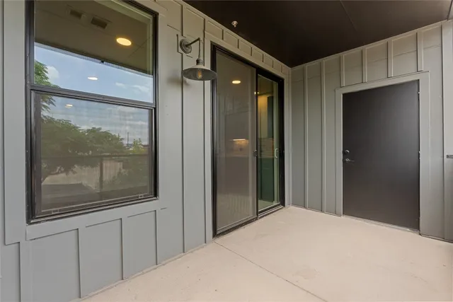 a view of a bathroom with a glass door shower and sink