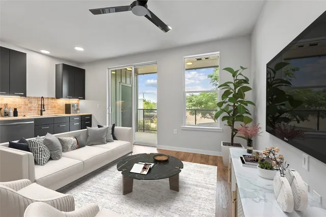 a living room with furniture and a large window