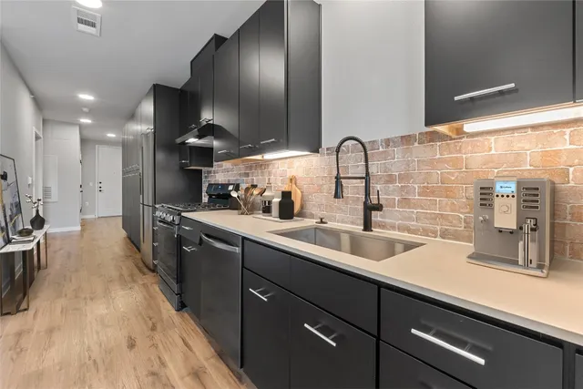 a kitchen with lots of counter space and a sink
