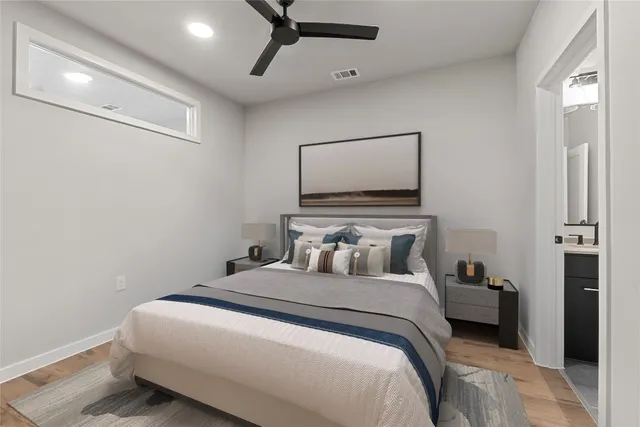 a bedroom with a bed and a mirror