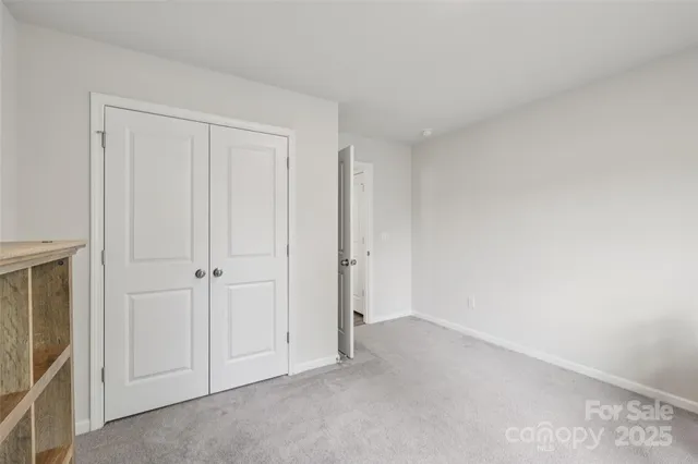 a view of an empty room and entryway