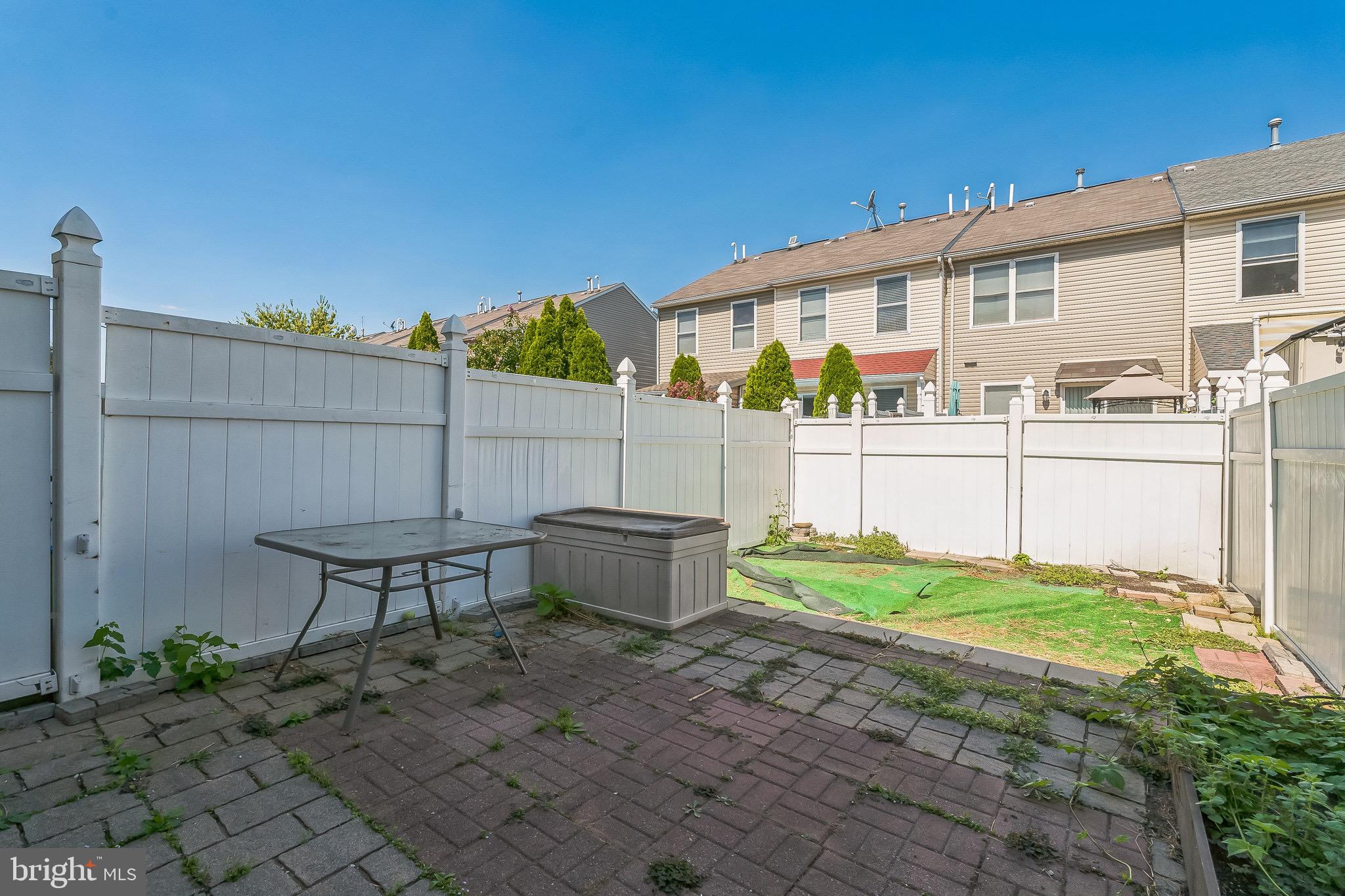 3566 Edgemont Street Philadelphia, PA 19134 - Photo 23 of 25 a backyard of a house with table and chairs