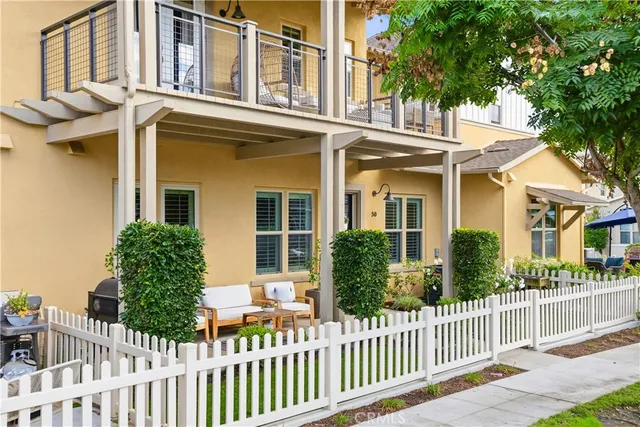 a bedroom with a bed and a potted plant