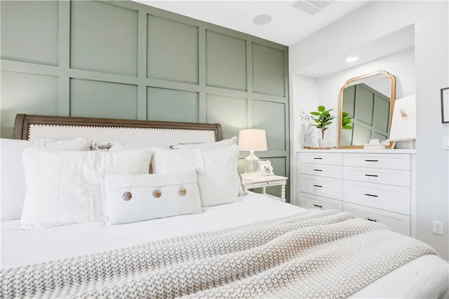 a view of a balcony with chair and wooden floor