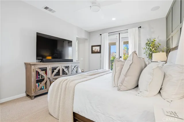 a bedroom with furniture and a window