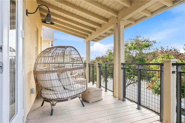 a living room with furniture kitchen view and a window