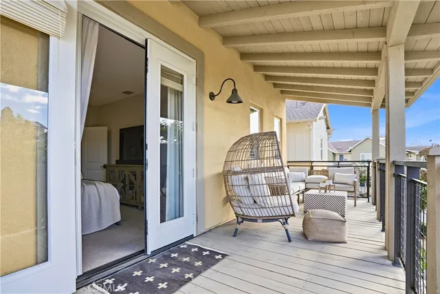 a view of a bedroom with wooden floor and hallway