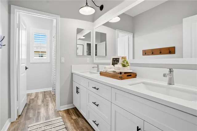 a bathroom with a sink mirror and toilet