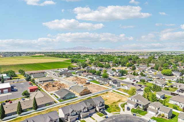 3215 West 450 North West Point, UT 84015 - Photo 39 of 40 Aerial perspective showcasing a residential community with established homes, new construction, and undeveloped lots