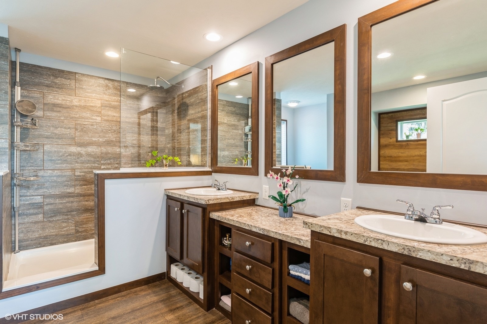 206 Big Peninsula Road Elgin, IL 60123 - Photo 11 of 23 a bathroom with a granite countertop sink a large mirror and a shower