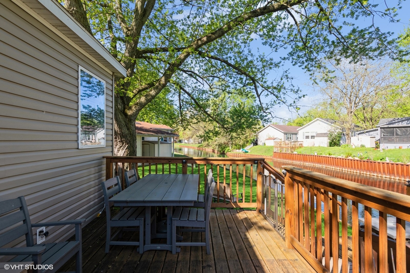 206 Big Peninsula Road Elgin, IL 60123 - Photo 21 of 23 a view of a deck with wooden floor and fence