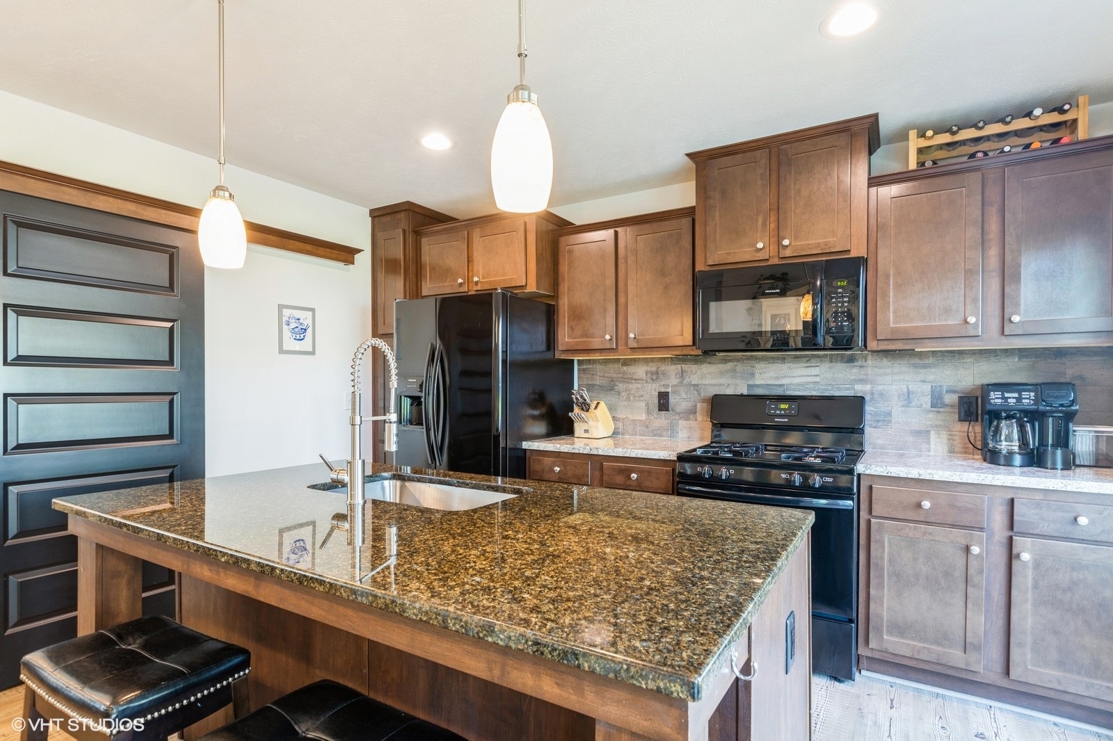 206 Big Peninsula Road Elgin, IL 60123 - Photo 3 of 23 a kitchen with kitchen island granite countertop a sink stove and cabinets