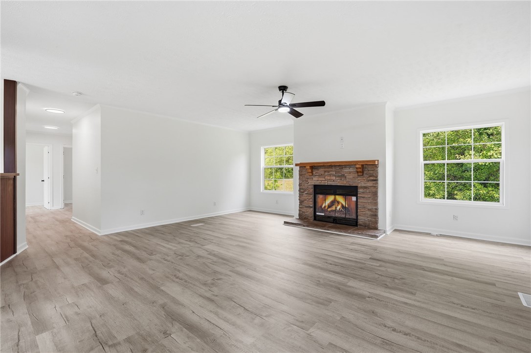 112 Sir Francis Drake Way Liberty, SC 29657 - Photo 16 of 42 Bright and airy living area with a beautiful stone fireplace and ample natural light.