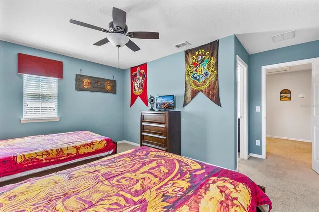 a bedroom with a bed and a dresser in it