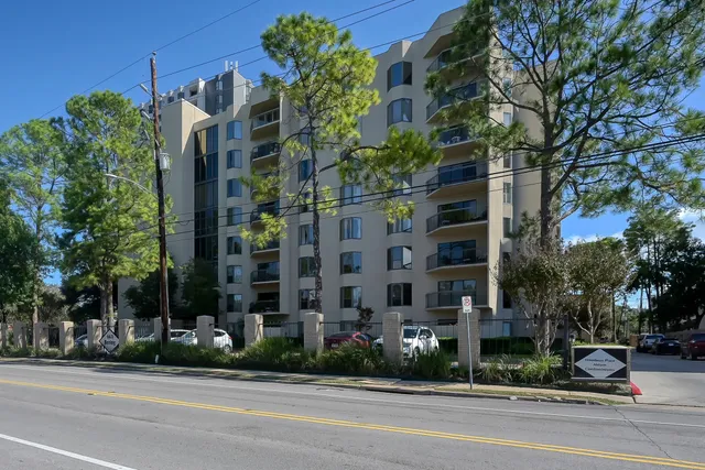 front view of a building with a garden
