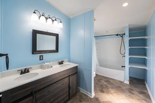 a bathroom with a double vanity sink mirror and double