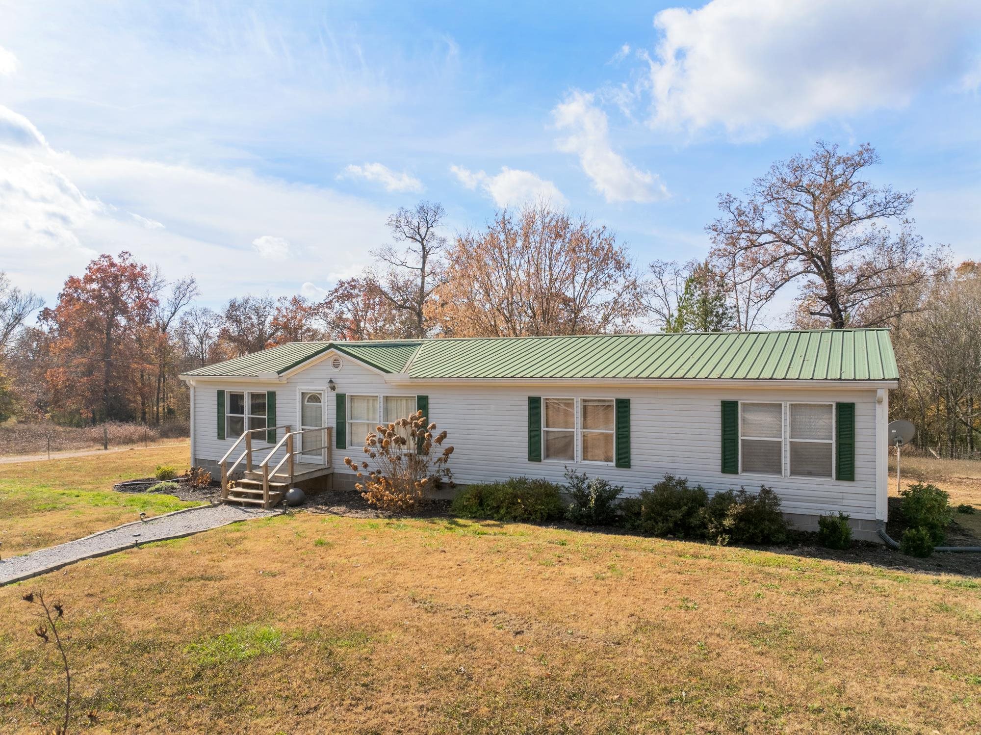 875 Lindsey Road Parsons, TN 38363 - Photo 2 of 38 front view of a house with a yard