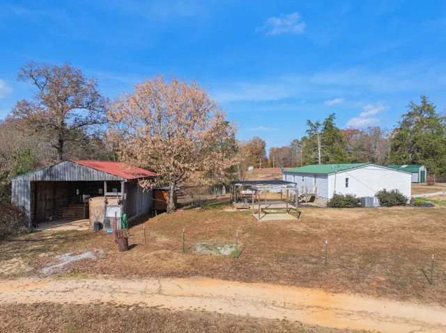 a view of a town with large trees