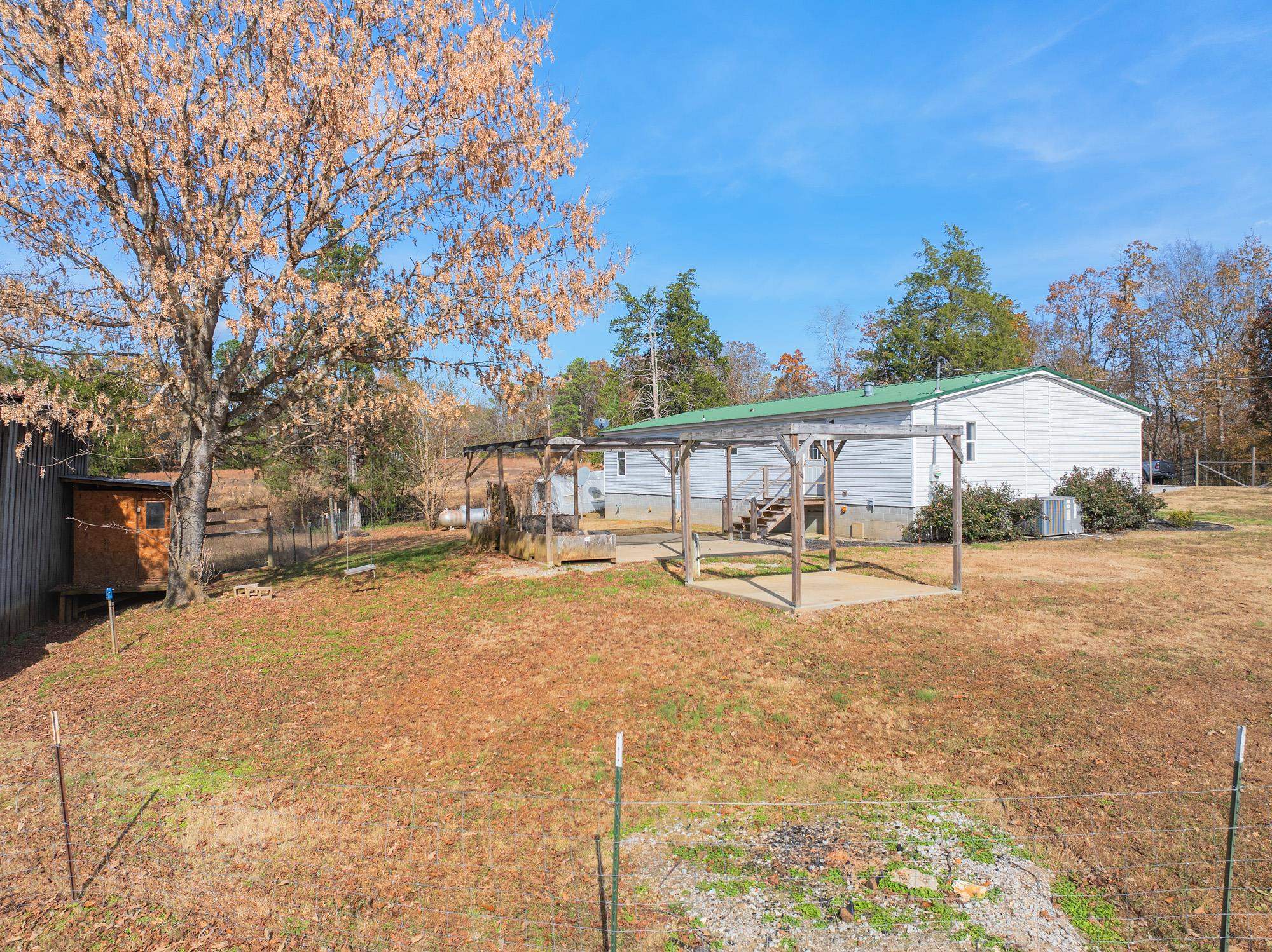 875 Lindsey Road Parsons, TN 38363 - Photo 24 of 38 a view of a swimming pool with a patio