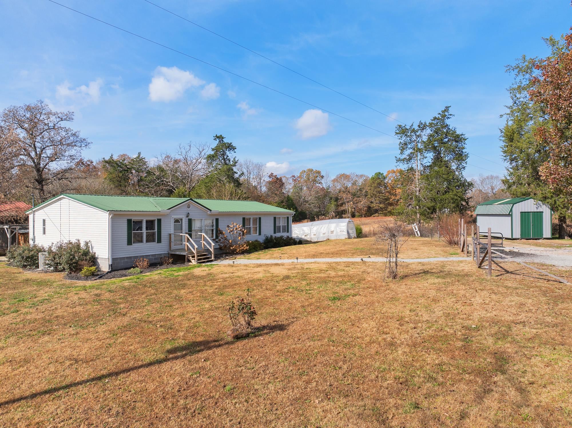 875 Lindsey Road Parsons, TN 38363 - Photo 35 of 38 a front view of a house with a yard