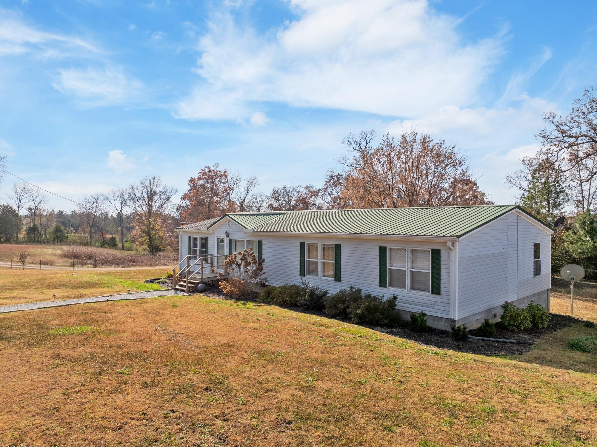 875 Lindsey Road Parsons, TN 38363 - Photo 36 of 38 a view of a house with a yard