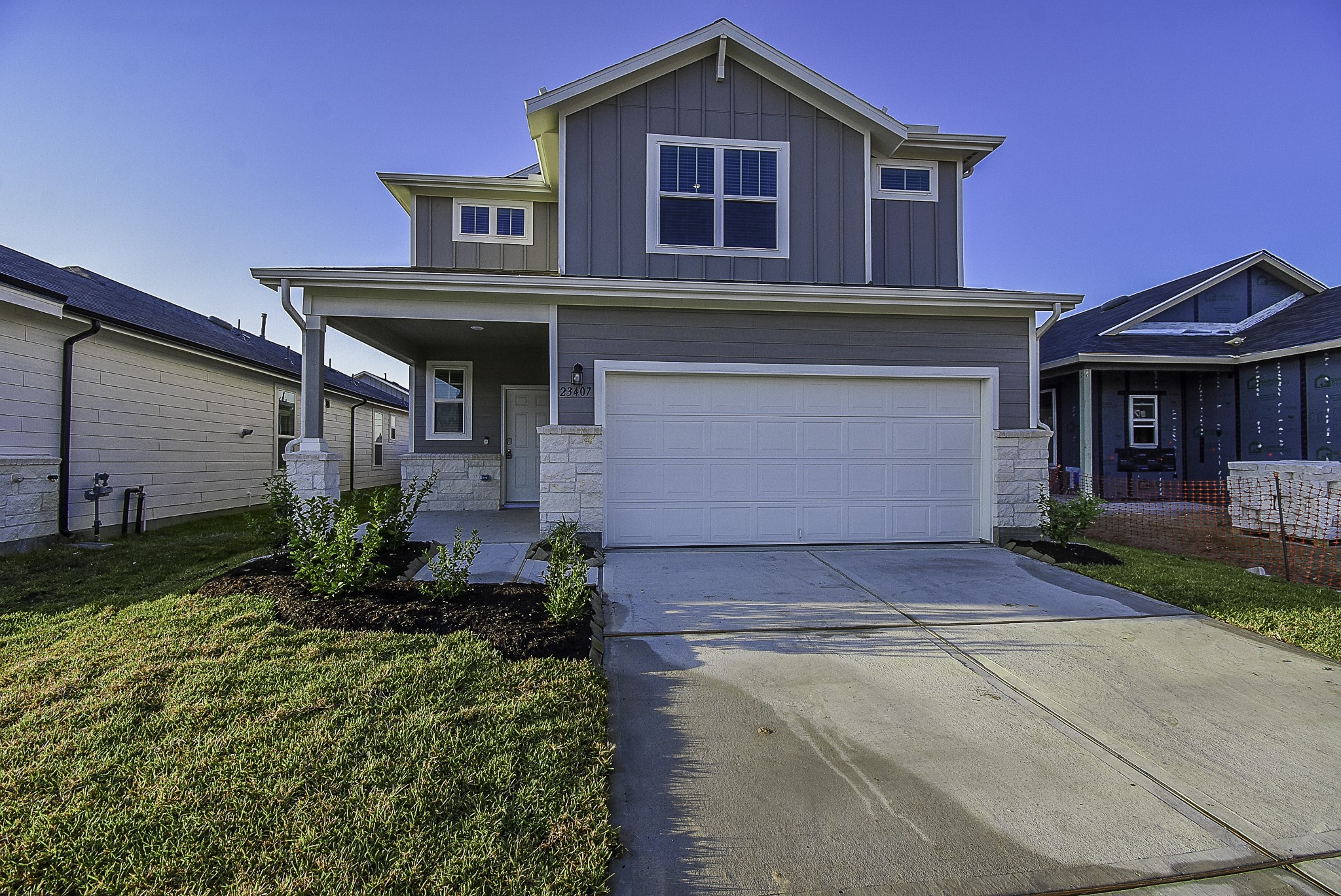 23407 Honey Spade Road Hockley, TX 77447 - Photo 1 of 34 a front view of a house with garden