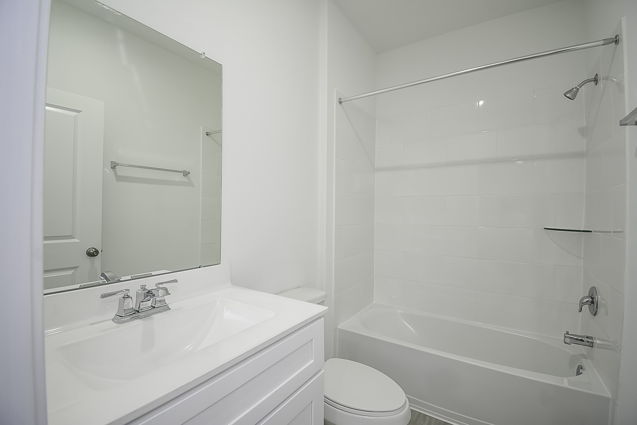 23407 Honey Spade Road Hockley, TX 77447 - Photo 20 of 34 a bathroom with a bathtub shower sink vanity and toilet