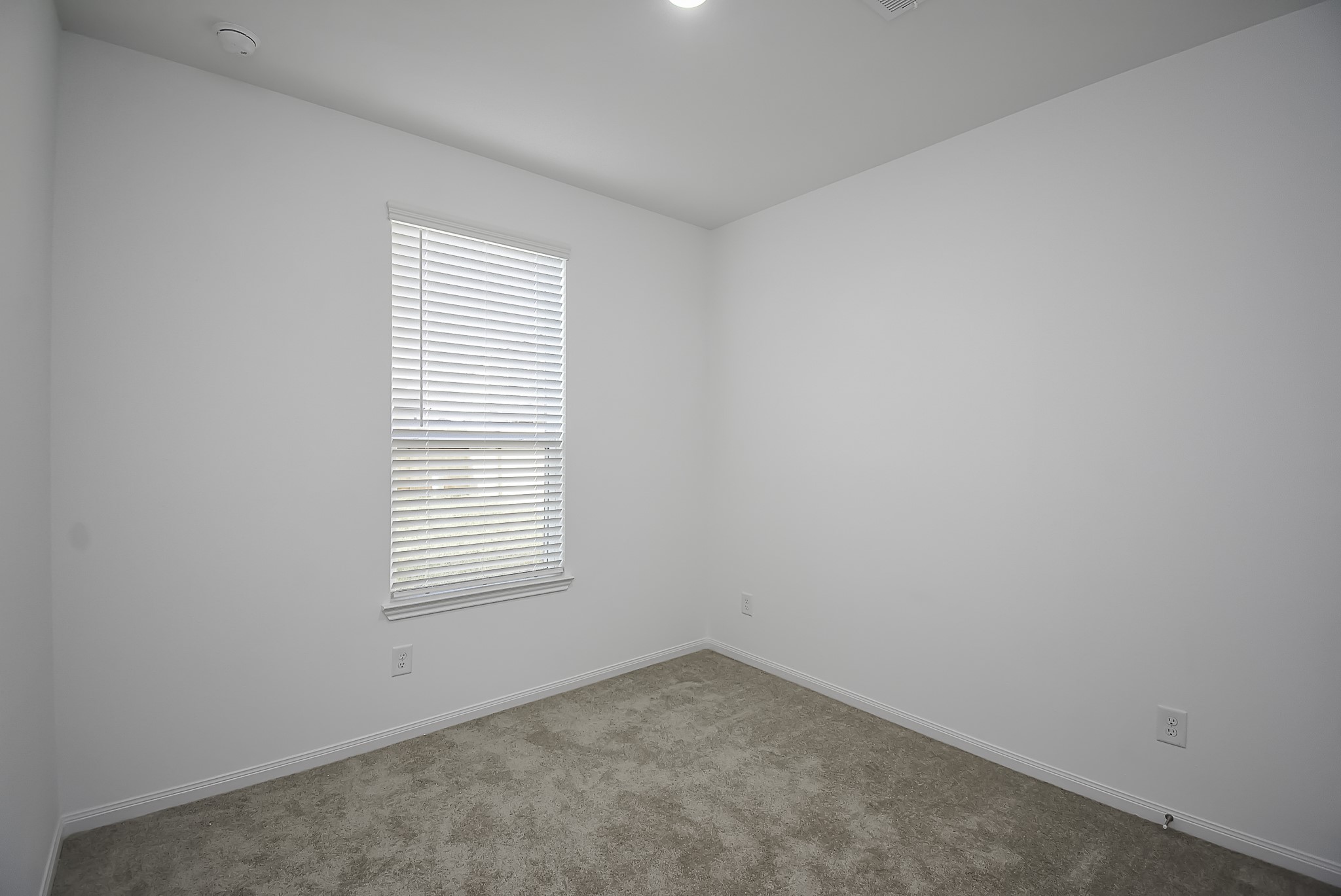23407 Honey Spade Road Hockley, TX 77447 - Photo 10 of 34 an empty room with a window