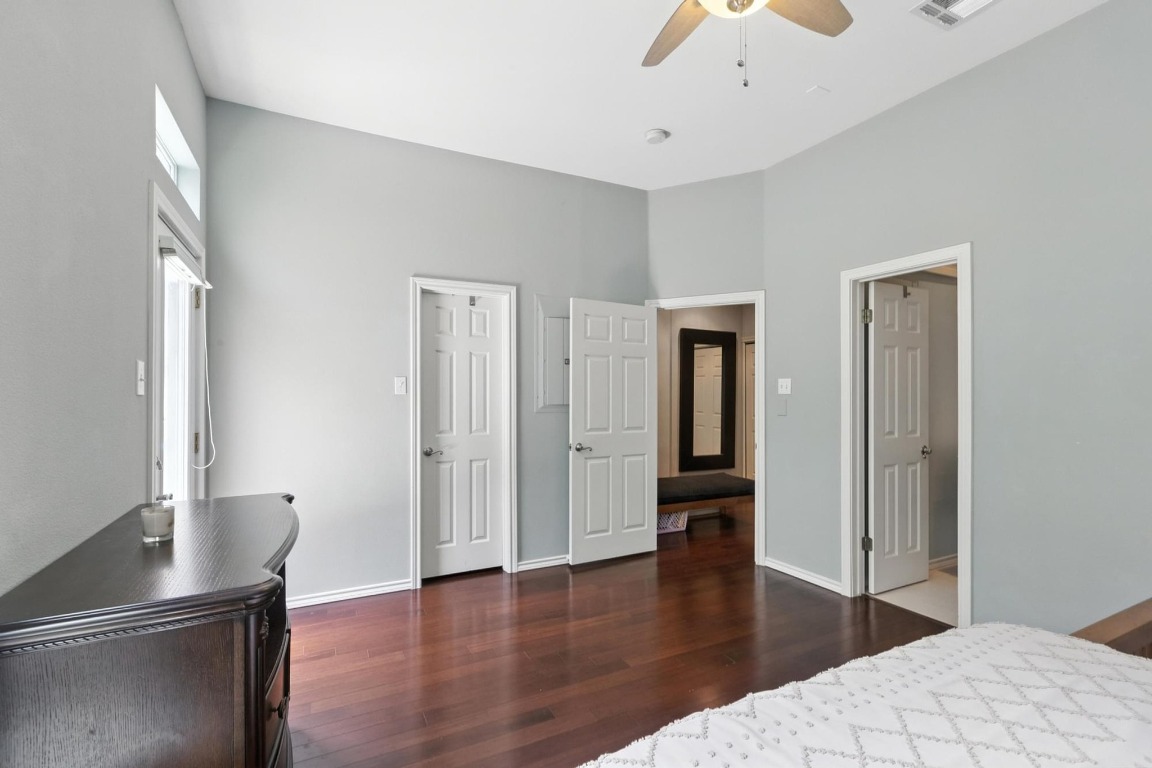 2918 Ranch Road 620, Unit 185 Austin, TX 78734 - Photo 21 of 39 a hallway with wooden floor chandelier and entryway