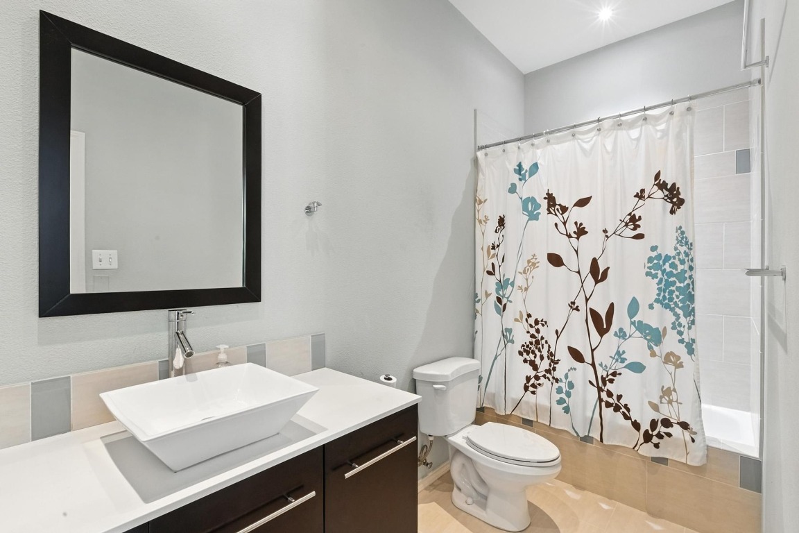 2918 Ranch Road 620, Unit 185 Austin, TX 78734 - Photo 22 of 39 a bathroom with a sink and a mirror