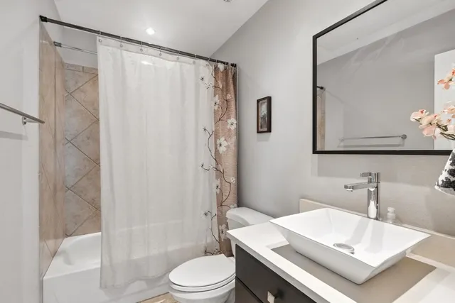 a view of a brick house with a large window