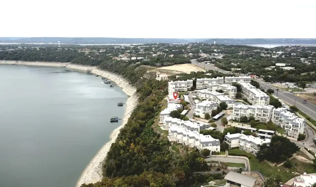 a bedroom with a dresser and a shower