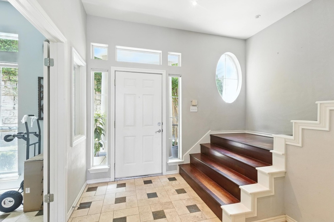 2918 Ranch Road 620, Unit 185 Austin, TX 78734 - Photo 5 of 39 a living room with a mirror and a shower