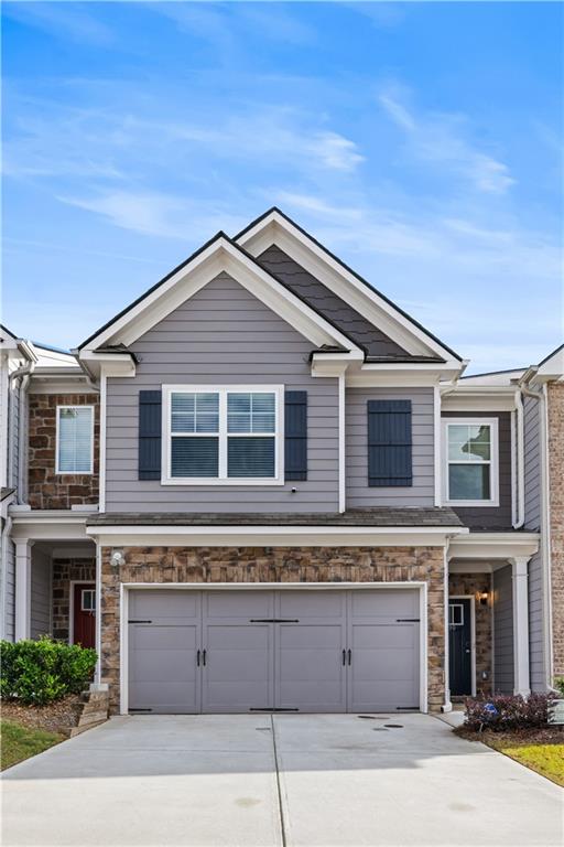 7690 Baron Road Fairburn, GA 30213 - Photo 1 of 29 a front view of a house with a garage
