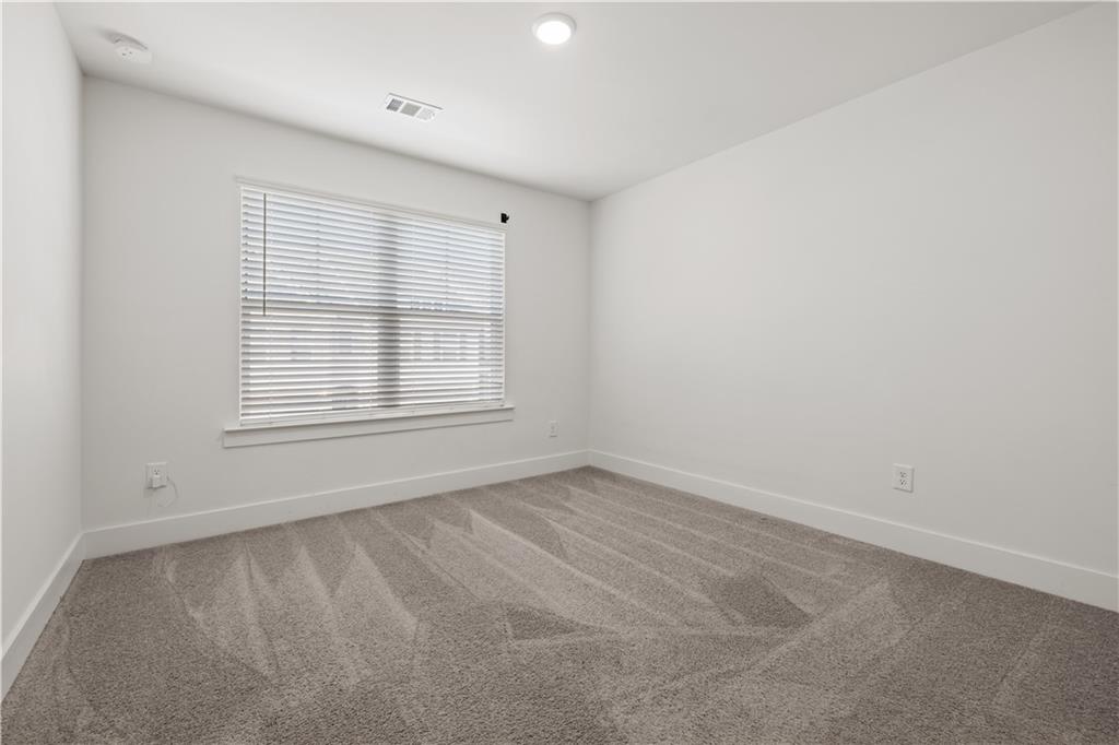 7690 Baron Road Fairburn, GA 30213 - Photo 20 of 29 an empty room with a window