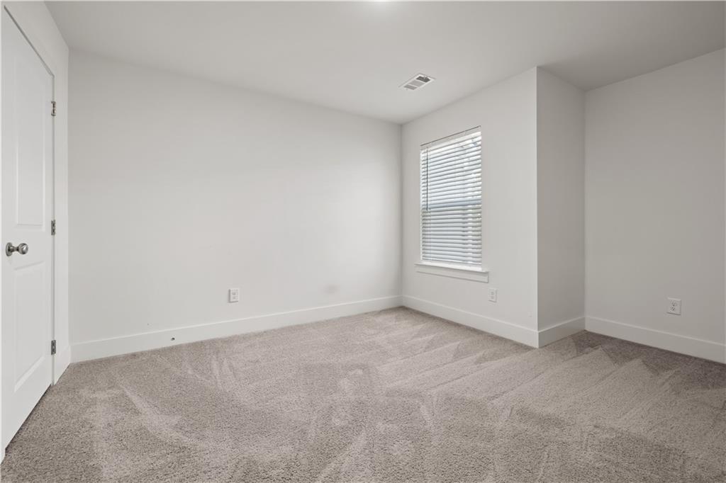 7690 Baron Road Fairburn, GA 30213 - Photo 21 of 29 a view of an empty room with a window