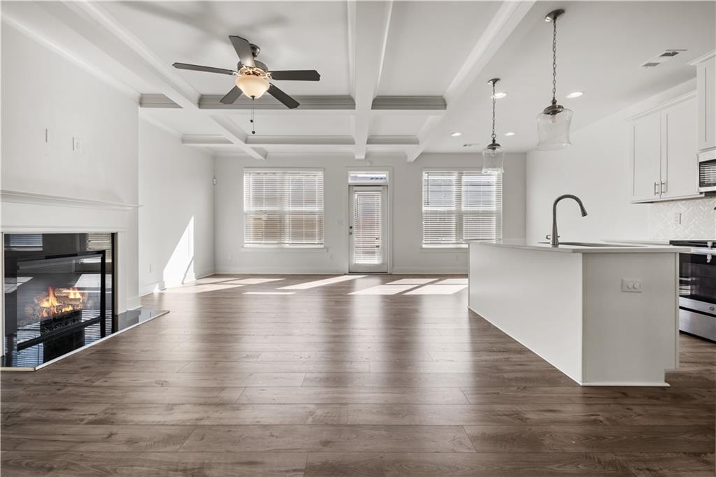 7690 Baron Road Fairburn, GA 30213 - Photo 4 of 29 a view of a kitchen with sink microwave and cabinets