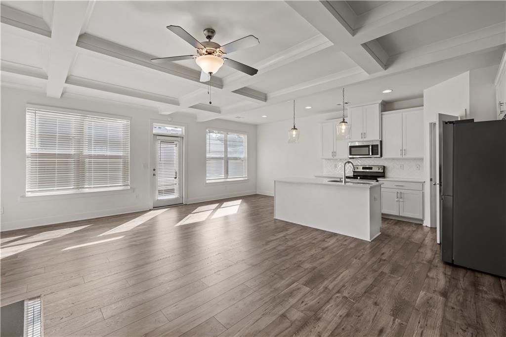 7690 Baron Road Fairburn, GA 30213 - Photo 9 of 29 a view of an empty room with kitchen appliances and a window