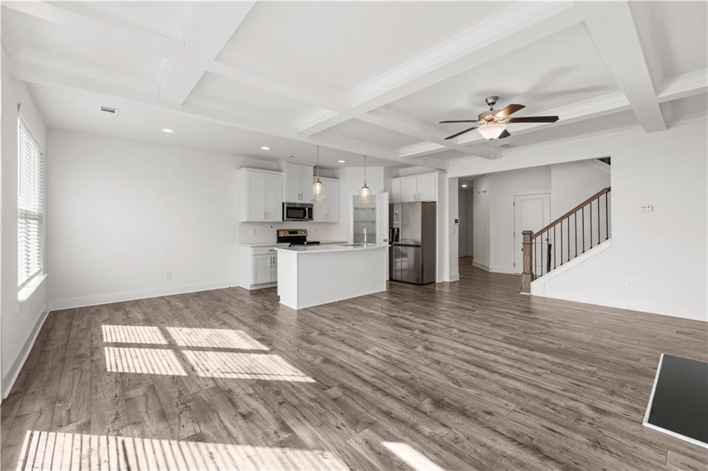 7690 Baron Road Fairburn, GA 30213 - Photo 10 of 29 a view of kitchen with sink microwave and refrigerator
