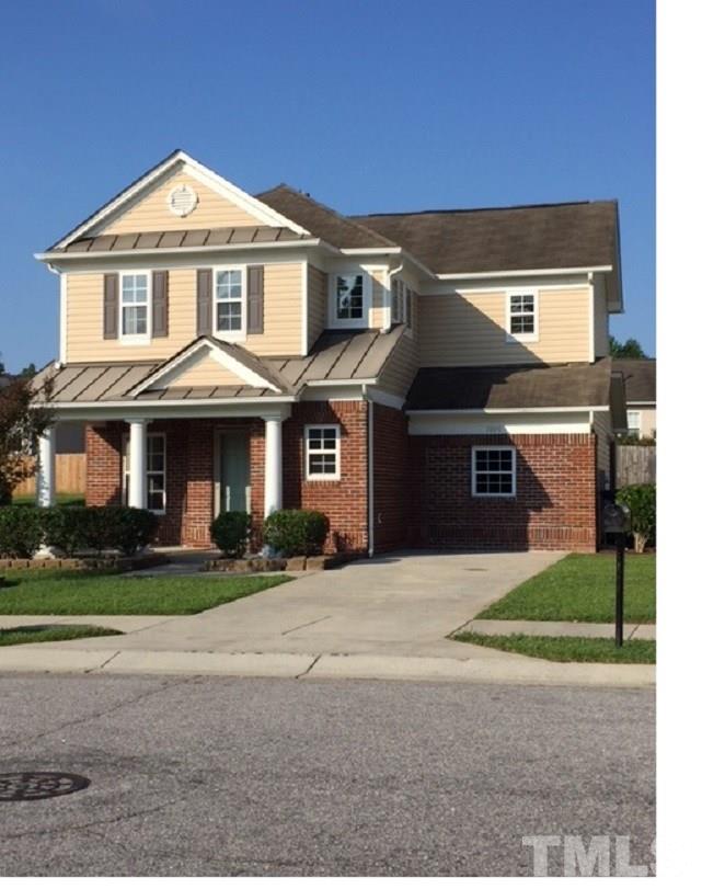 3800 Tryon Ridge Drive Raleigh, NC 27610 - Photo 1 of 18 a front view of a house with a yard