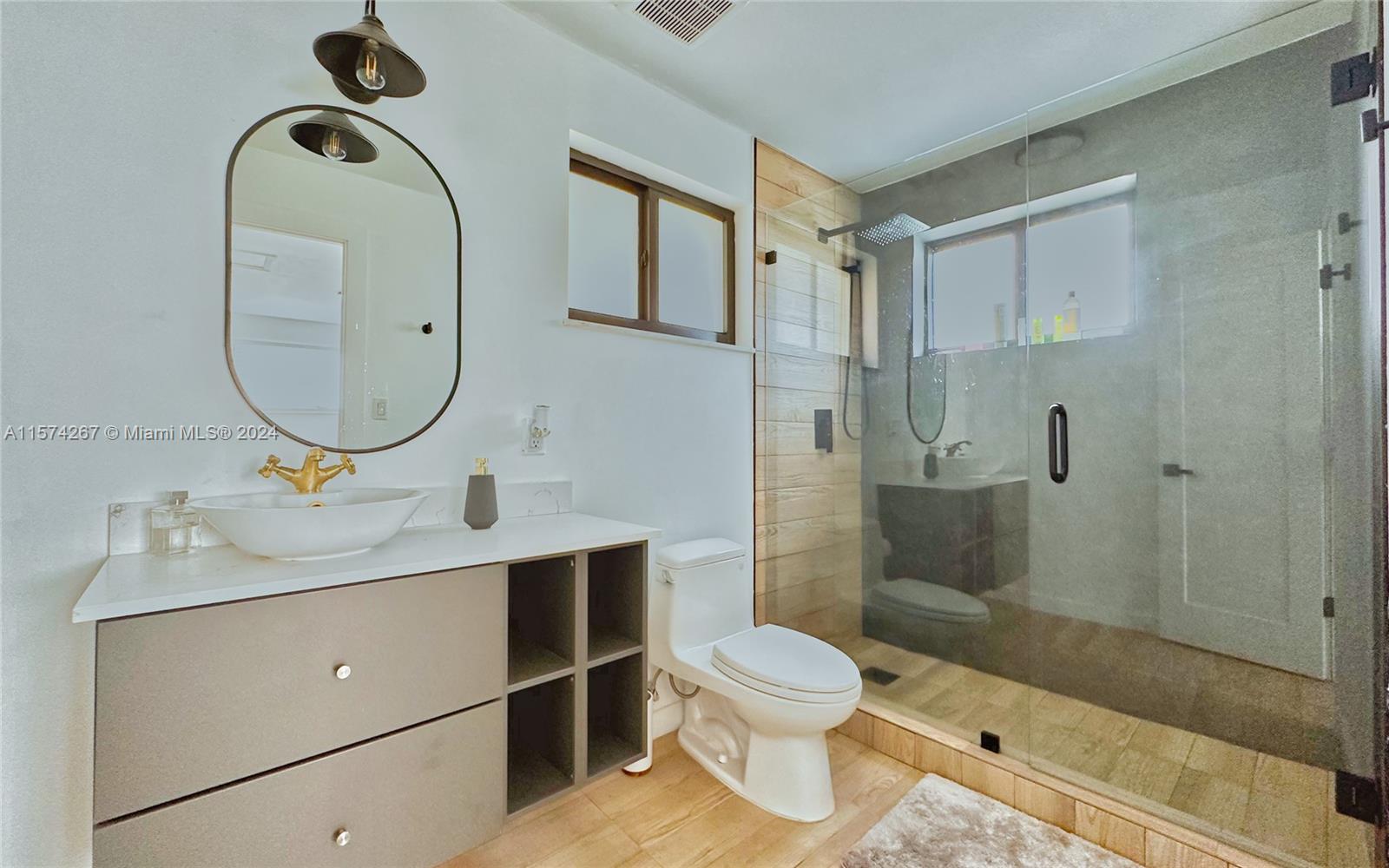 7040 Southwest 17th Terrace Miami, FL 33155 - Photo 11 of 26 a bathroom with a sink a toilet and shower