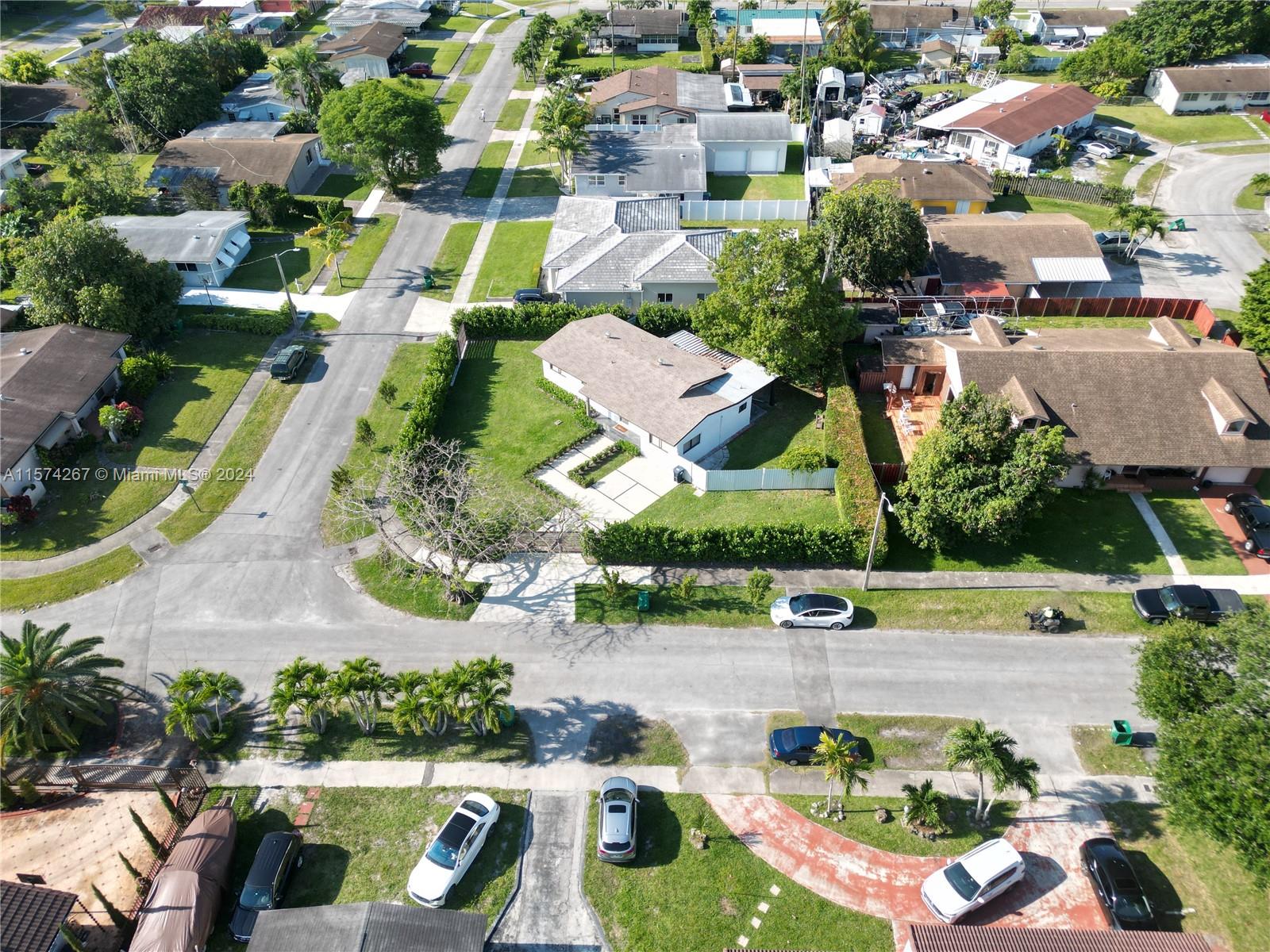 7040 Southwest 17th Terrace Miami, FL 33155 - Photo 19 of 26 an aerial view of residential houses with outdoor space and parking