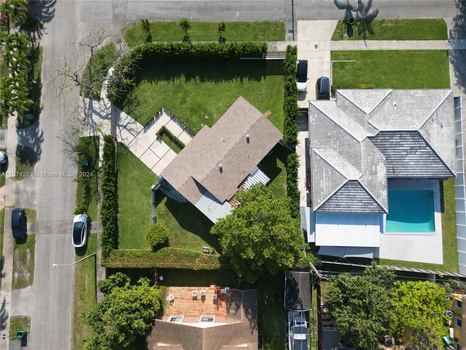 7040 Southwest 17th Terrace Miami, FL 33155 - Photo 22 of 26 an aerial view of a house with a garden and lake view
