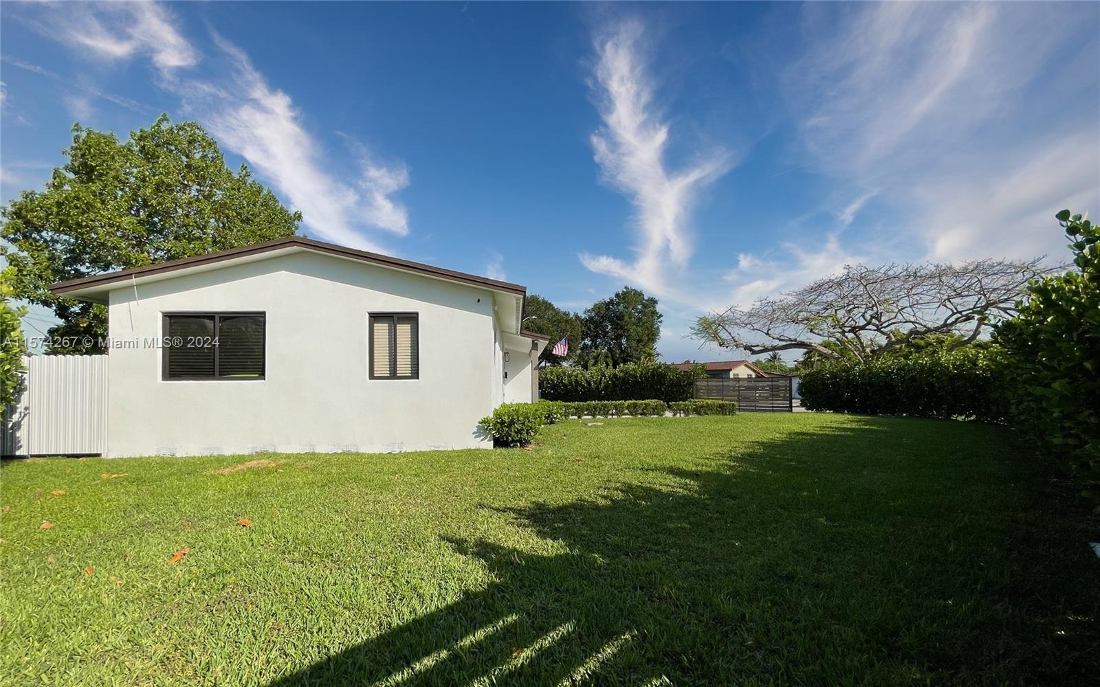 7040 Southwest 17th Terrace Miami, FL 33155 - Photo 23 of 26 a view of backyard of house with green space