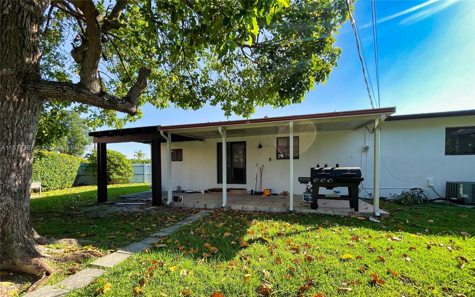 7040 Southwest 17th Terrace Miami, FL 33155 - Photo 26 of 26 a front view of a house with garden