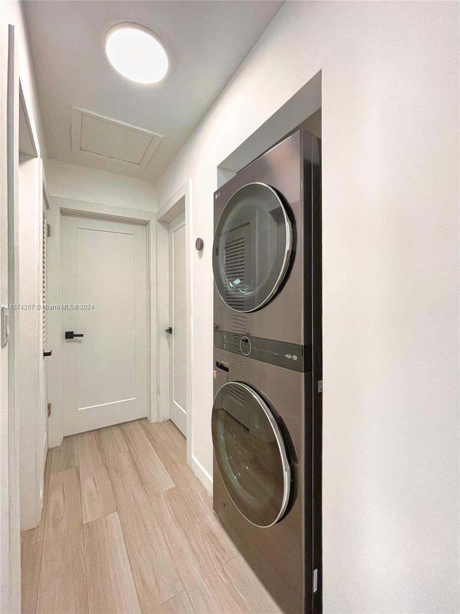 7040 Southwest 17th Terrace Miami, FL 33155 - Photo 4 of 26 a view of a hallway with washer and dryer