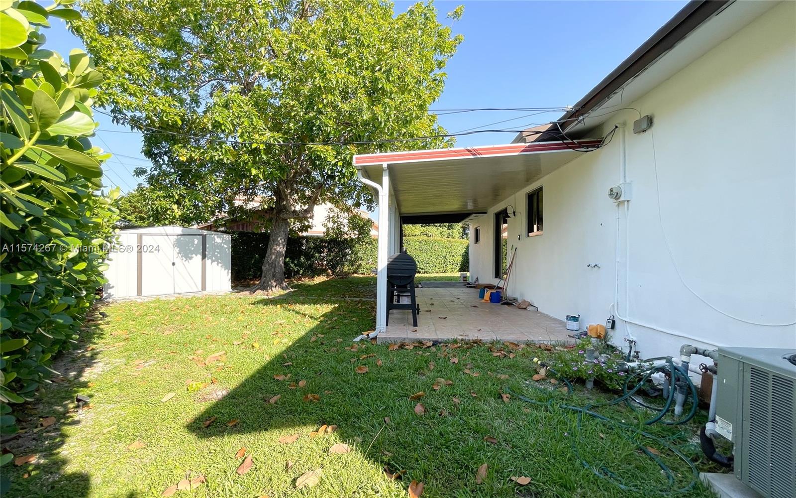7040 Southwest 17th Terrace Miami, FL 33155 - Photo 9 of 26 a view of house with a yard