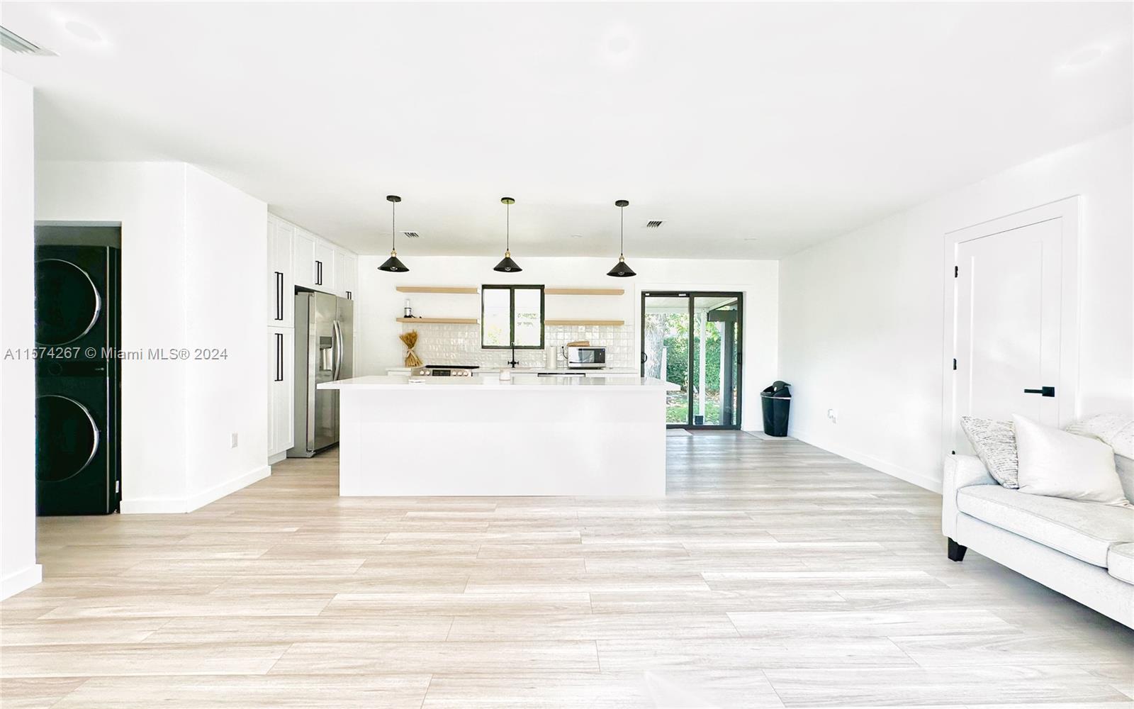 7040 Southwest 17th Terrace Miami, FL 33155 - Photo 10 of 26 a large white room with kitchen island