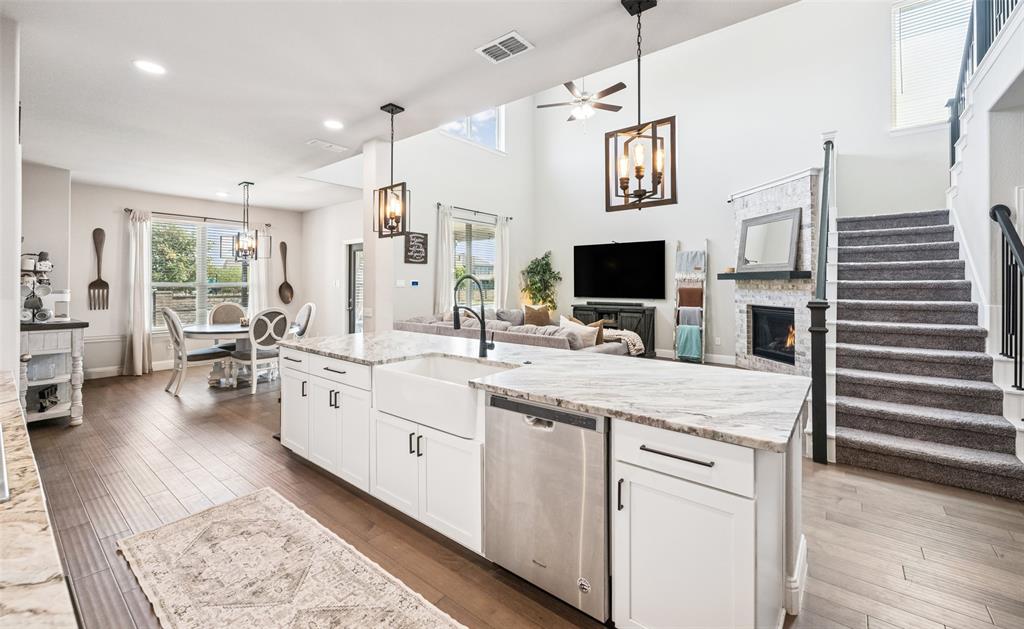 11852 Toppell Trail Fort Worth, TX 76052 - Photo 13 of 32 a kitchen with stainless steel appliances granite countertop a stove a sink and a refrigerator
